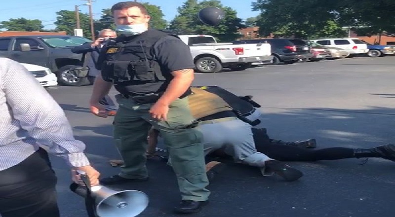 Amy Cooper shared a video of her friends being harassed by the police, on Facebook. In Burlington, North Carolina, Cooper and her friends were protesting, in a public parking lot, when the police asked them to leave. One of Cooper's friends, a black man, was handcuffed by police, cooperating by walking with them, when one officer tripped him to the ground, and the others began to beat him on the parking lot pavement, while one cop tried to block Cooper from filming.