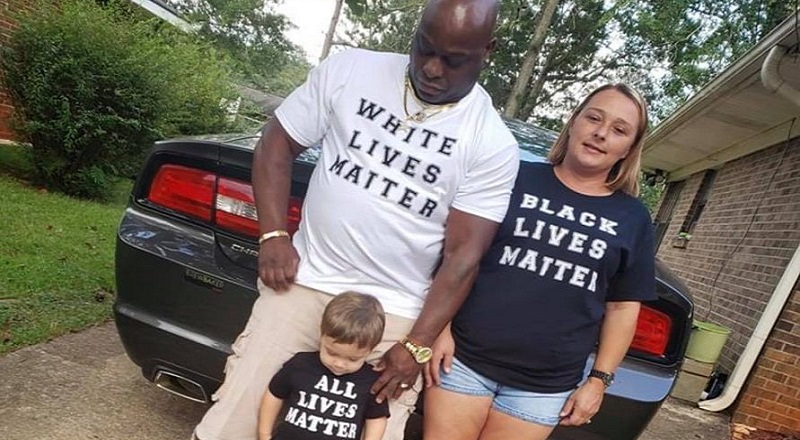 Elizabeth White, a well-known local news correspondent, has now jumped into the Black Lives Matter conversation. Some friends of hers recently adopted a child, a selfless act, and she shared their photo on her Facebook. Her friends are an interracial couple and they adopted a white child. The couple posed for a photo, which attempted to silence the race debate currently ongoing, with the black husband wearing a "White Lives Matter" shirt, the white wife wearing a "Black Lives Matter" shirt, and the child wearing an "All Lives Matter" shirt, sparking controversy on Facebook.