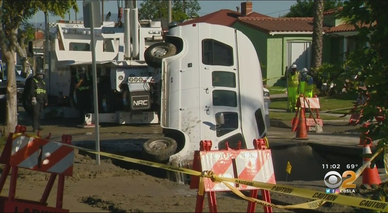 Amber Anderson's van falls into sinkhole, in front of her home in Crenshaw, Los Angeles.