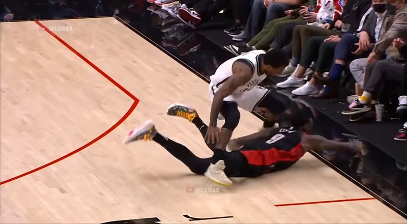 Kyrie Irving rolls his ankle diving for loose ball with Nasir Little